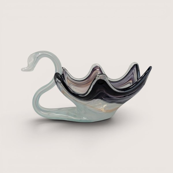 Vintage hand-blown art glass swan bowl featuring a light blue neck and a smoke grey ruffled body.