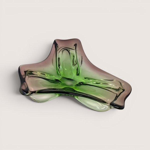Triangular mid-century Murano style glass freeform dish featuring folded edges in vivid green and amethyst purple tint.