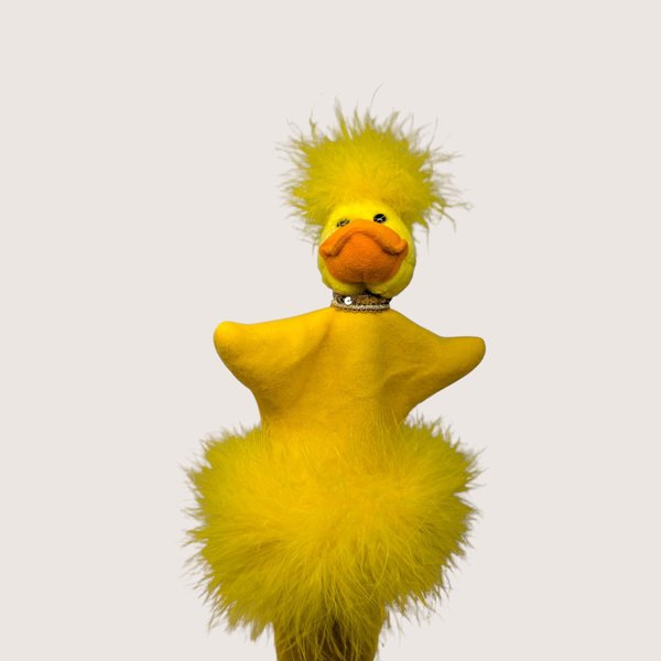 Vintage handmade felt and feather duck stick puppet in bright yellow with an orange bill and feather boa trim.