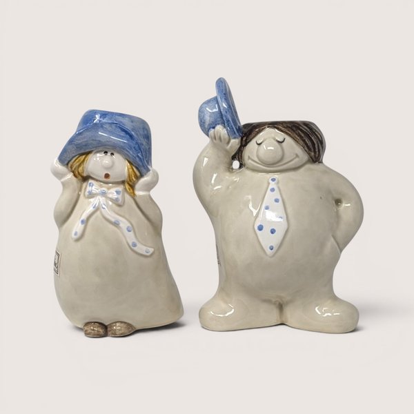 Vintage Fitz and Floyd Hats Off ceramic bud vase pair featuring figures in blue polka dot hats and ties against a neutral background.