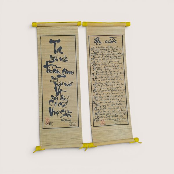 Vintage Vietnamese bamboo scroll set with black calligraphy script and red seal stamps against a neutral background.