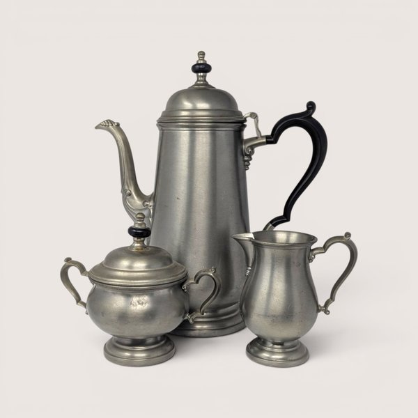 Vintage Three-Piece Oneida Heirloom Pewter Tea Set including teapot, sugar bowl, and creamer.