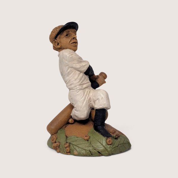Vintage 1980s Tom Clark Cairn Studios "Joltin Joe" baseball player figurine seated with a bat on a leaf and acorn base.