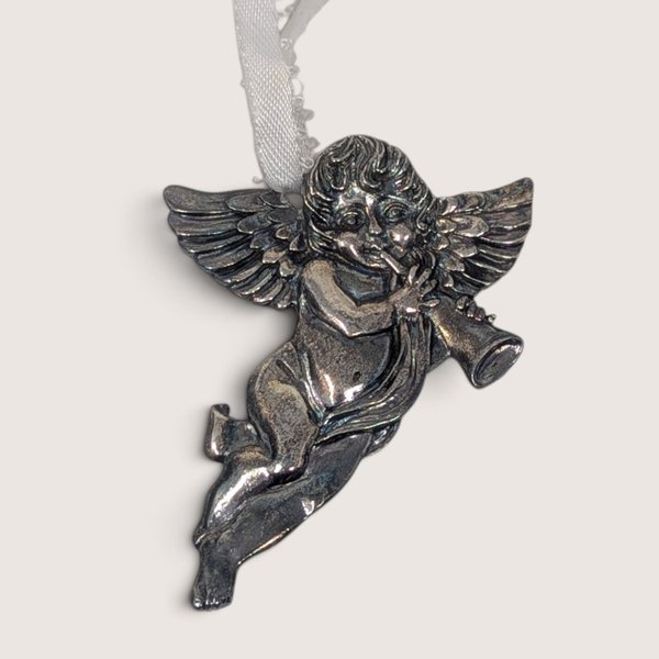 Vintage pewter cherub or angel ornament marked R and B on the back with a white ribbon hanger