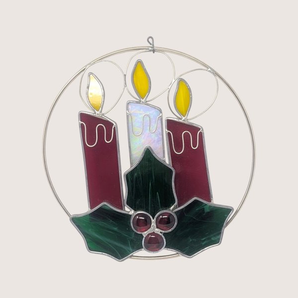 Vintage iridescent stained glass Christmas candles suncatcher featuring green holly leaves, red wax drips, and glass jewel berries.