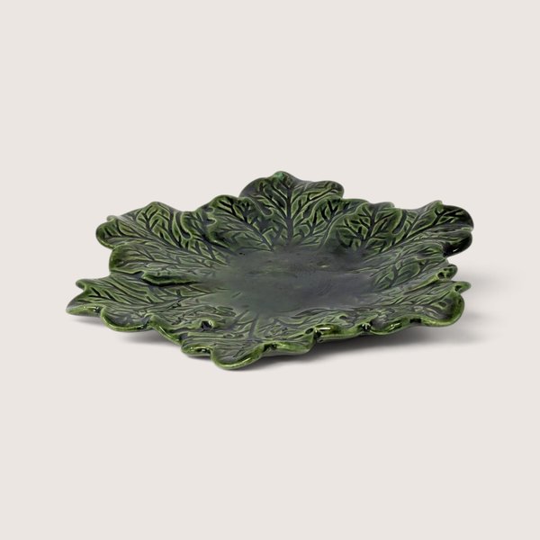 Vintage hand-painted green ceramic leaf plate featuring glossy majolica-style texturing and deep vein details.