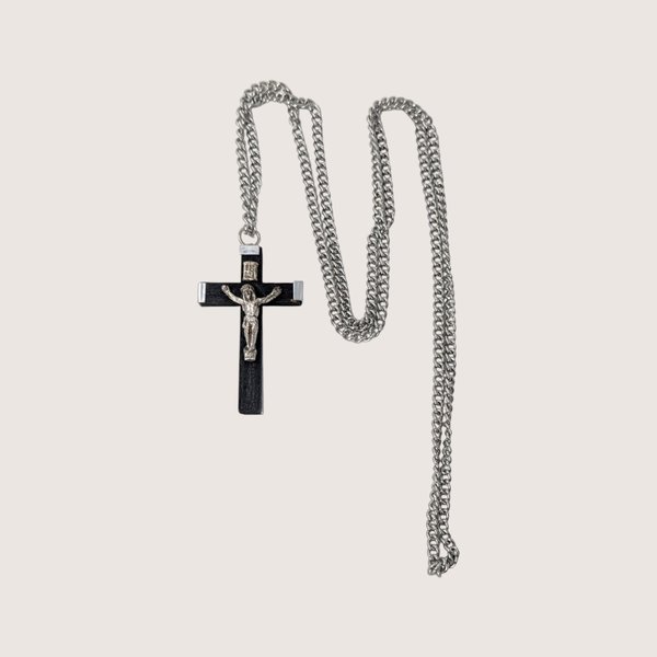 Vintage black and silver-tone crucifix pendant necklace on a long continuous chain.