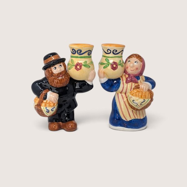 Vintage Lotus handcrafted ceramic Thanksgiving man and woman taper candle holders holding harvest jugs.