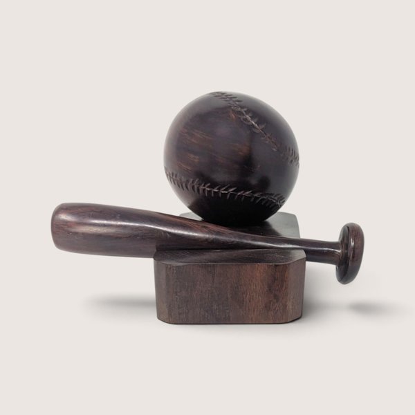 Vintage hand-carved wooden baseball and bat display figurine on a dark wood block base.