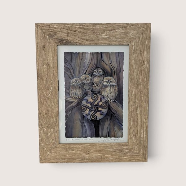 Vintage framed art print titled Little Owl Medicine by artist Jody Bergsma featuring four small owls in a tree.