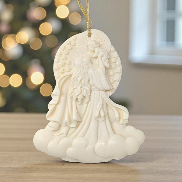 Cream-colored resin ornament featuring a relief carving of Mary holding the infant Jesus.